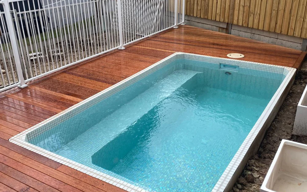 Fully tiled plunge pool set into a hardwood timber deck